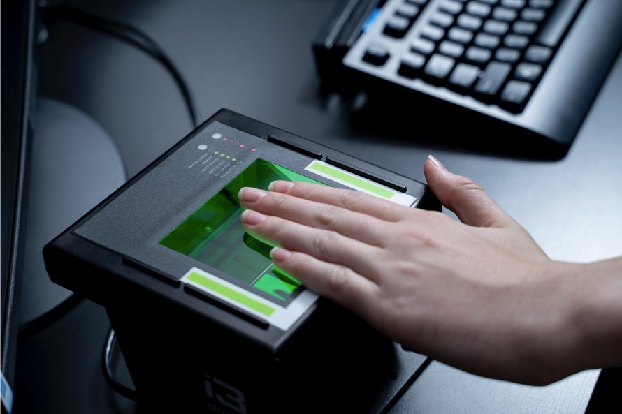 Person giving a fingerprint on a scanner